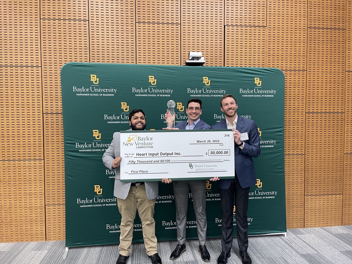 HEARTio cofounders holding a $50,000 first place check at the Baylor New Venture Competition