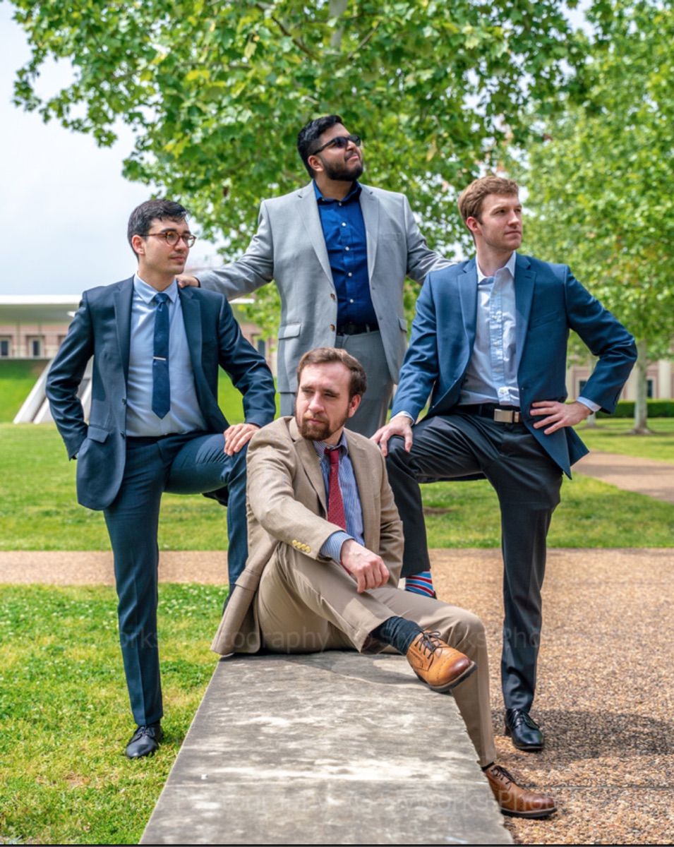 The four-person HEARTio team posing on a lawn at the Rice Business Plan Competition